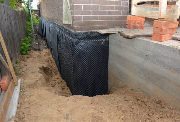 Happy homeowners after waterproofing job in West Friendship